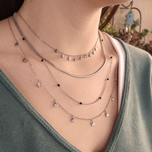 close-up shot of a necklace worn by a woman