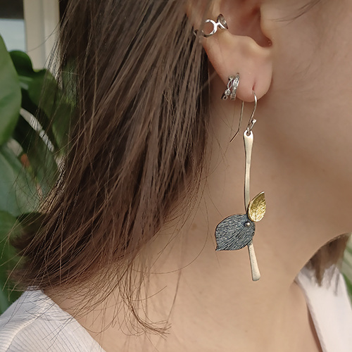 close-up shot of earrings worn by a woman